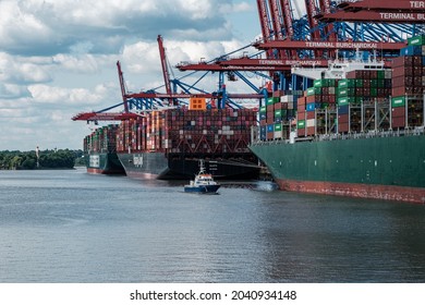 HAMBURG, GERMANY - Aug 24, 2021: The Three Big Container Ships Theseus, Ever Grade, And Barzan Being Loaded In The Port Of Hamburg