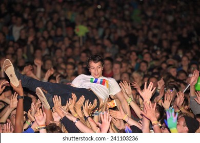 HAMBURG, GERMANY - AUGUST 15, 2014: German DJ And Producer ALLE FARBEN Doing A Stage Dive At MS Dockville Festival On August 15, 2014 In Hamburg.