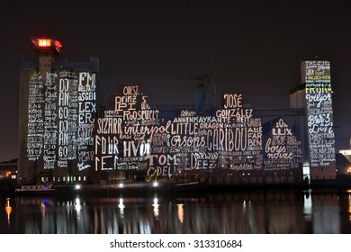 HAMBURG, GERMANY - AUGUST 23, 2015: The Industrial Complex Of The Rethespeicher Was Artistically Illuminated Showing The Concert Lineup During The MS Dockville Festival On August 21, 2015 In Hamburg. 