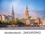 Hamburg, Germany colorful pink sunset or sunrise view of city center with Rathaus town hall and Alster lake