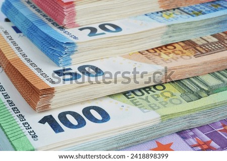 Hamburg, Germany - December 22, 2022: Bundles of Euro banknotes, stacks of banknotes, European Union currency, money background 