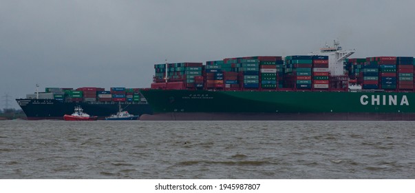 Hamburg, Germany - February 06: Container ship CSCL Indian Ocean China Shipping Line ran aground on the Elbe near Hamburg and the HANJIN Long Beach drove by