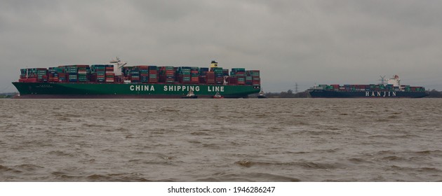 Hamburg, Germany - February 06: Container ship CSCL Indian Ocean China Shipping Line and HANJIN Long Beach on the Elbe near Hamburg on the way to the Port of Hamburg container terminal