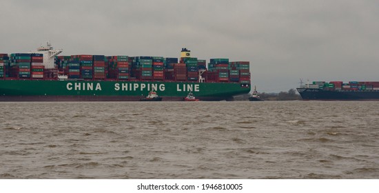 Hamburg, Germany - February 06: Container ship CSCL Indian Ocean China Shipping Line and HANJIN Long Beach on the Elbe near Hamburg on the way to the Port of Hamburg container terminal