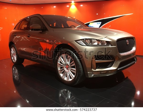 Hamburg, Germany - February 7, 2017: Gray\
metallic Jaguar F-Pace car X761, compact luxury crossover SUV made\
by the British car manufacturer Jaguar, advertising place in public\
airport terminal