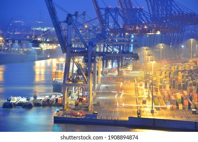 Hamburg, Germany - January 21, 2019: Night view of Hamburg harbor with Tollerort Container terminal - Port of Hamburg is Germany's largest port and is named the country's "Gateway to the World" 