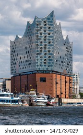 Hamburg, Germany - July 27, 2019: The Concert Hall Elbphilharmonie on a sunny day. It is situated in the port and the HafenCity quarter on the Grasbrook peninsula of the Elbe River.