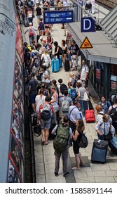 Hamburg, Germany - June 29, 2019: People entering a train from a platform of the central railway station of Hamburg, Germany on June 29, 2019