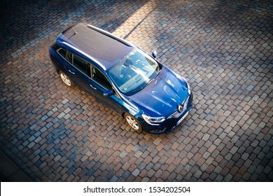 Hamburg, Germany - Mar 2018: View From Above Overhead View Of Blue New Renault Wagon Car Parked On The Cobblestone Parking