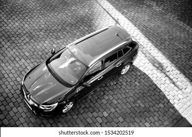 Hamburg, Germany - Mar 2018: View From Above Overhead View Of New Renault Wagon Car Parked On The Cobblestone Parking Black And White Image