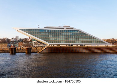 HAMBURG, GERMANY - MARCH 10: Dockland Viewd From The Elbe On March 10, 2014 In Hamburg. It Is A Futuristic Office Building In Form Of A Parallelogram With A Roof Terrace And Diagonal Elevators.