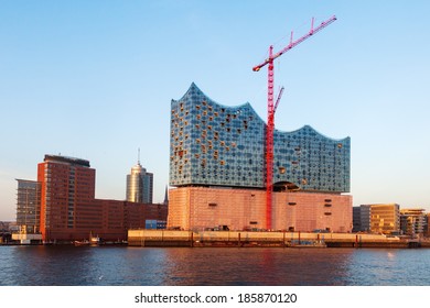 HAMBURG, GERMANY - MARCH 10: Elbphilharmone in the harbor on March 10, 2014 in Hamburg. It's a concert hall under construction in the HafenCity on top of an old warehouse with a final height of 110 m.
