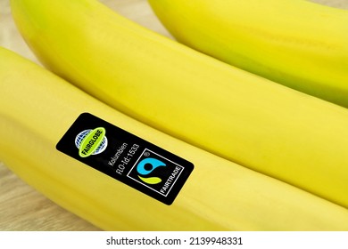 Hamburg, Germany - March 14  2022:  Bananas From Colombia With Fair Trade Logo And Fairglobe
