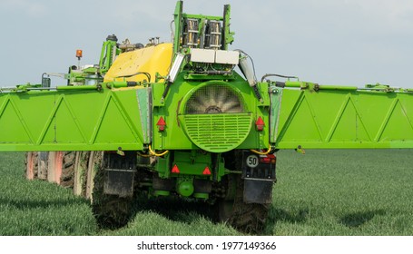 Hamburg, Germany - May 15, 2021: Tractor Fendt Favorit 824 With Dammann Profi Class Field Sprayer Applying Pesticides Against Pesticides