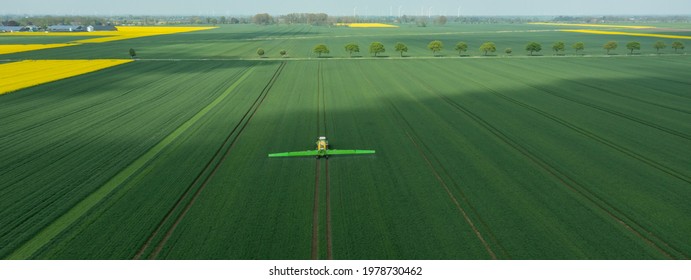 Hamburg, Germany - May 15, 2021: Tractor Fendt Favorit 824 With Dammann Profi Class Field Sprayer Applying Pesticides Against Pesticides