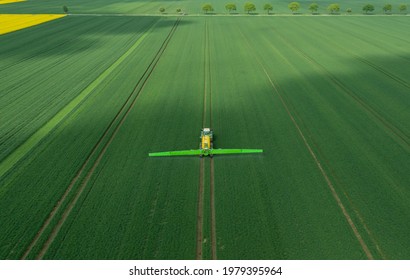 Hamburg, Germany - May 15, 2021: Tractor Fendt Favorit 824 With Dammann Profi Class Field Sprayer Applying Pesticides Against Pesticides