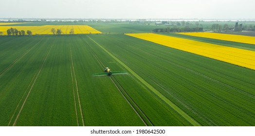 Hamburg, Germany - May 15, 2021: Tractor Fendt Favorit 824 With Dammann Profi Class Field Sprayer Applying Pesticides Against Pesticides