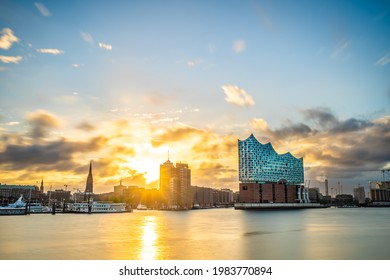 Hamburg, Germany - May 23, 2021: Sunrise in the port of Hamburg with a view on the famous concert hall Elbphilharmonie.
