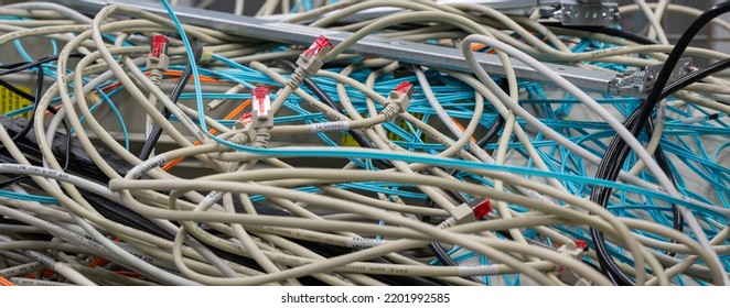 Hamburg, Germany - September 14, 2022: In The Data Center Are Old IT Network Cables And Power Cables Stored In A Lattice Box For Disposal