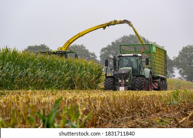 Hamburg, Germany - September 30, 2020: FENDT 930 Vario Tractor With Joskin Silospace Silage Wagon And John Deere 8800i Maize Chopper During The Maize Harvest