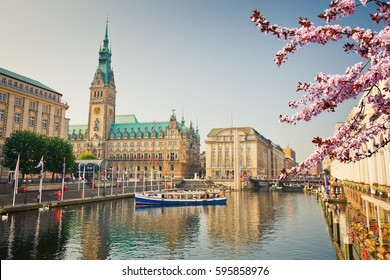Hamburg townhall and Alster river at spring - Shutterstock ID 595858976