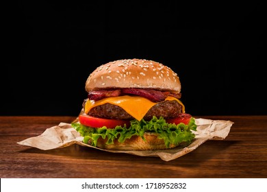 Hamburger with bacon and cheese and salad