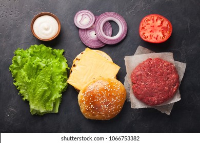 Hamburger Building Kit. Fresh Ingredients For Burger On Dark Stone Table. Top View