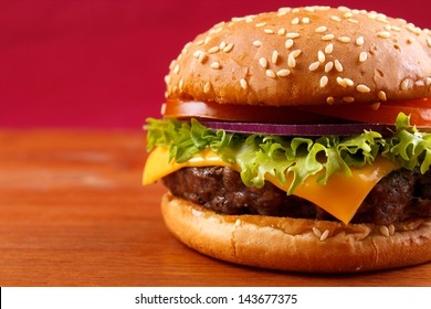 Hamburger closeup on red background with copyspace