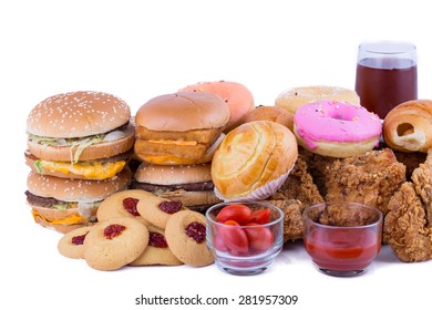 hamburger with fried chicken, donuts and candy on a white background.