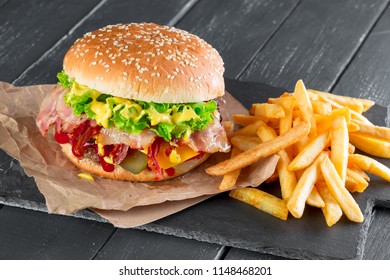 Hamburger with fries on a slate plate - Powered by Shutterstock