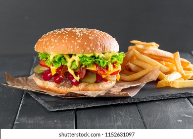 Hamburger with fries on a slate plate - Powered by Shutterstock