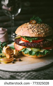 hamburger on a wooden table - Shutterstock ID 773325028