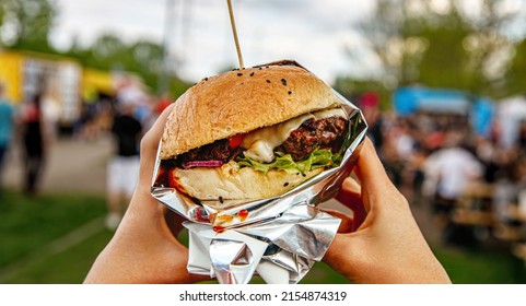 Hamburger At Outdoor Street Food Market Festival In A Park