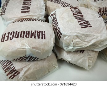 Hamburger In Paper Wrap Background