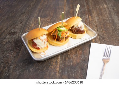 Hamburger Sliders On A Metal Tray With Rustic Wooden Background