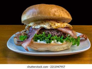 Hamburger Top With Bacon  And Egg On A Brioche Roll