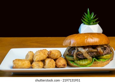 Hamburger Top With Onions  And  Pickles Served With Veggie Tots