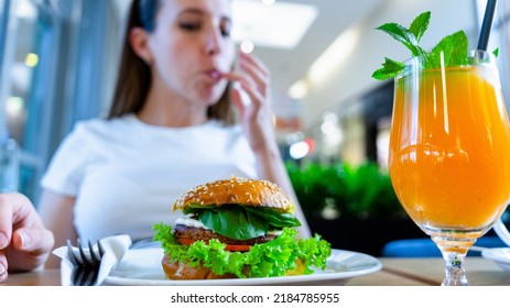 Hamburger Vegan Healthy Vegetarian Burger. Salad, Avocado, Vegetable On Veggie Sandwich Eating Cute Woman. Tasty Vegetarian Healthy Green Food
