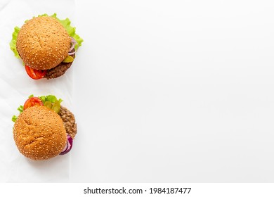 Hamburgers isolated on white with beef meat steak and vegetales