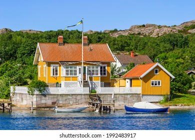 Hamburgsund, Sweden, July, 2017, Old cottage with a jetty and boats in the Swedish archipelago