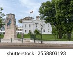 Hamilton, Bermuda. Cenotaph, The Cabinet Building, Flag of Bermuda,  British Overseas Territory of Bermuda red ensign, Front Street. Cenotaph, empty tomb or war monument, replica of London