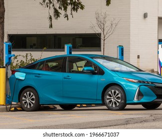 Hamilton, Canada, April 30, 2021; A Toyota Electric Vehicle Plugged Into A Rio Tinto Flo Electric Vehicle (EV) Charging Station