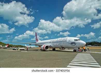 HAMILTON ISLAND, AUSTRALIA - OCTOBER 3,2015: Ground Crew Attend A Virgin Australia Boeing 737. Hamilton Island  Is The Only Island On The Great Barrier Reef With Its Own Airport.