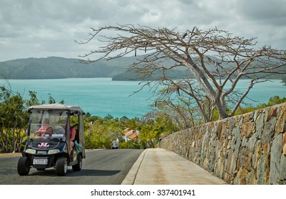 HAMILTON ISLAND, AUSTRALIA - OCTOBER 4,2015: Two Women Drive A Golf Buggy To Their Destination. Golf Buggies And Complimentary Buses Are The Only Vehicles Available To The Public Here.