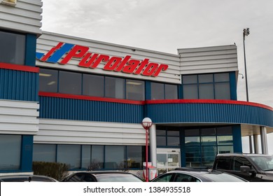 Hamilton, Ontario, Canada. April 29 2019. Purolator offices located at Hamilton airport. Photo of the front of the buildings entrance with the company's logo on the building.  