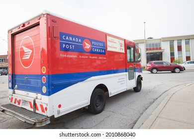 Hamilton, Ontario, Canada - July 2021: A Canada Post Delivery Truck Approaches  The Road For Mail Delivery Service.