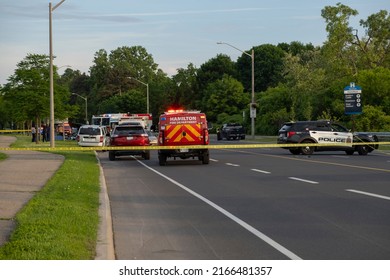 Hamilton Ontario Canada Jun 11 2022: Police SUV Trucks, Paramedics, Ambulances, Fire Trucks Present At Accident Scene At Area Closed Off With Yellow Tape. Multi Vehicle Fatal Crash At York Boulevard.