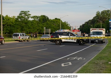 Hamilton Ontario Canada Jun 11 2022: Police SUV Trucks, Paramedics, Ambulances, Fire Trucks Present At Accident Scene At Area Closed Off With Yellow Tape. Multi Vehicle Fatal Crash At York Boulevard.