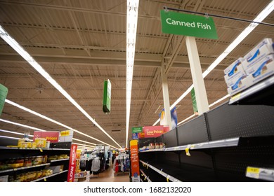 Hamilton, Ontario / Canada - March 2020: Partial Empty Shelves Inside A Walmart Canada Store. Supply Shortage Due To Pandemic.