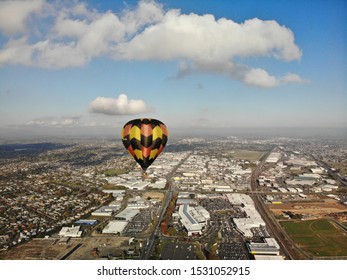 Hamilton, Waikato, New Zealand - October 15 2019: Balloon Drifting Through City With Fog